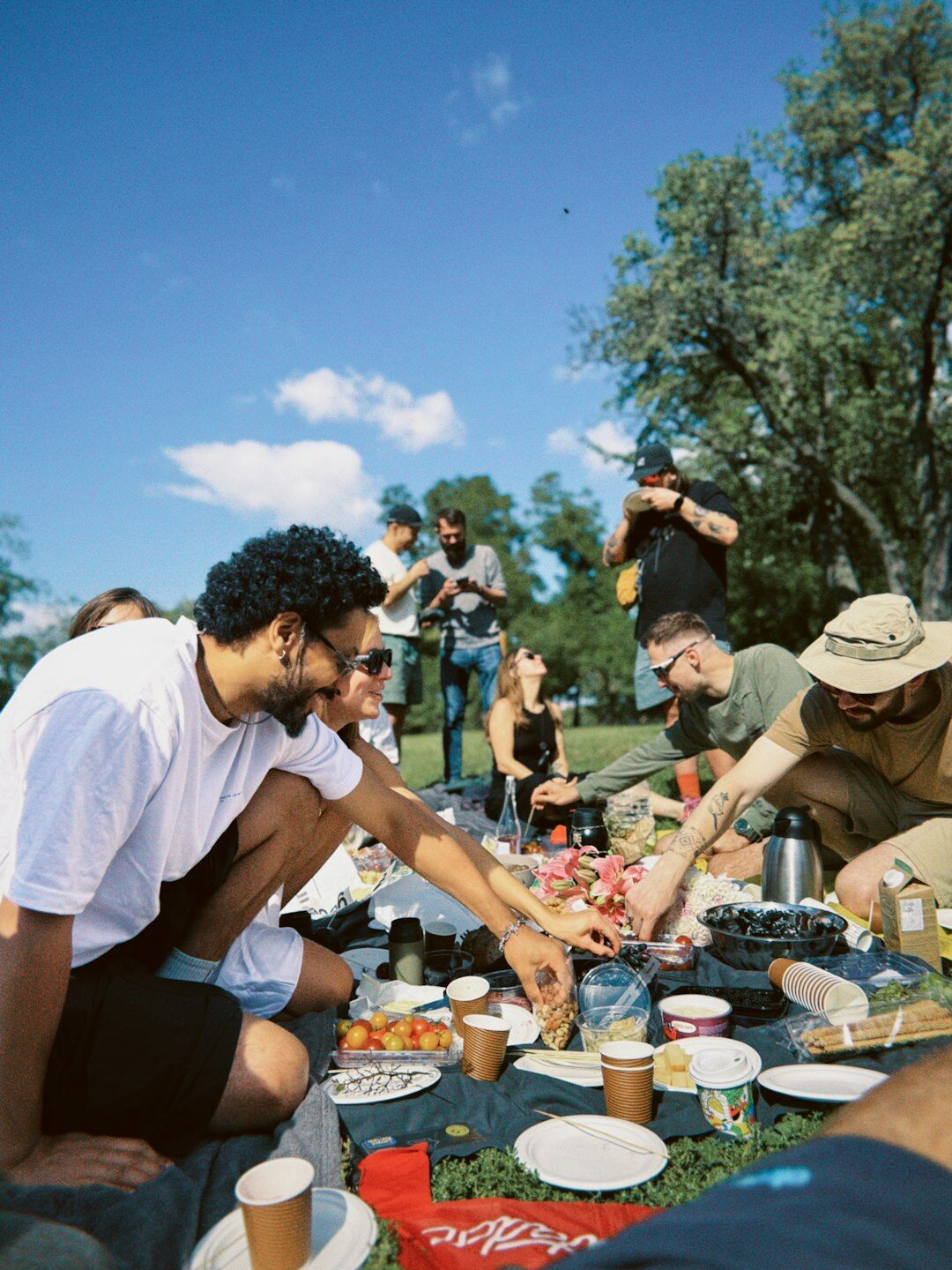 Colleagues enjoying an outdoor picnic during a team building day